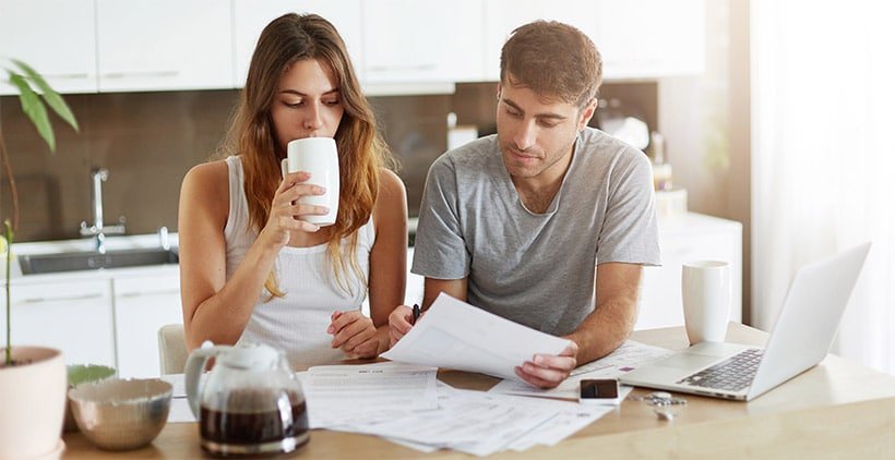 Couple check their Gas Water Heater Bill