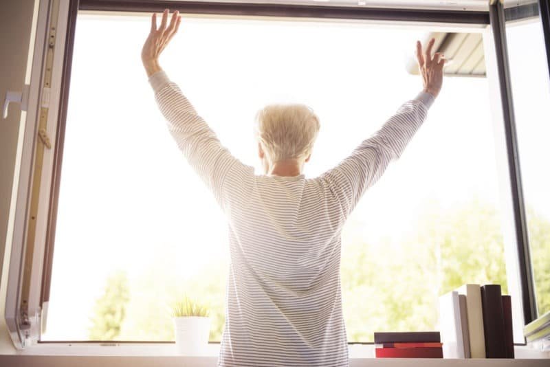 A woman open the window